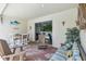 Cozy outdoor lanai, ideal for relaxation and dining, includes comfortable seating and a sliding glass door at 5904 114Th E Dr, Parrish, FL 34219