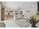 Open concept living area with kitchen, tile floors, and natural light at 5904 114Th E Dr, Parrish, FL 34219