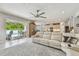 Living room showcasing a seamless transition to the outdoor pool, kitchen, and dining areas at 5904 114Th E Dr, Parrish, FL 34219
