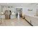 Open concept living area with tile floors flowing into a kitchen featuring stainless appliances at 5904 114Th E Dr, Parrish, FL 34219