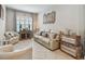 Comfortable living room with stylish furniture and plenty of natural light at 5904 114Th E Dr, Parrish, FL 34219