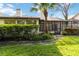 Beautifully maintained backyard featuring lush green grass and a view of the back of the house at 6203 Courtside Dr # 21, Bradenton, FL 34210