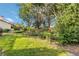 Picturesque backyard with lush greenery and mature trees offers a serene outdoor space at 6203 Courtside Dr # 21, Bradenton, FL 34210