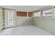 Unfinished basement with windows, drop ceiling and access to the outside via door at 6203 Courtside Dr # 21, Bradenton, FL 34210