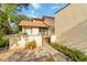 Charming villa featuring a well-manicured lawn with pathway to the front door at 6203 Courtside Dr # 21, Bradenton, FL 34210