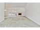 Spacious living room with fireplace and sliding glass doors to the patio at 6203 Courtside Dr # 21, Bradenton, FL 34210