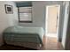Cozy bedroom with wood floors and a view of the community at 647 Woodlawn Dr # 647, Bradenton, FL 34210