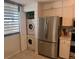Efficient kitchen space with stainless steel refrigerator and washer/dryer at 647 Woodlawn Dr # 647, Bradenton, FL 34210