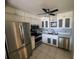 Well-lit kitchen with stainless steel appliances and white cabinets at 647 Woodlawn Dr # 647, Bradenton, FL 34210