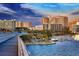 City skyline view from the bridge, showcasing waterfront condominiums and palm trees along the waterfront at 659 Maldives Trl, Sarasota, FL 34234