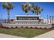 Gracewater community sign with lush landscaping and mature palm trees at 659 Maldives Trl, Sarasota, FL 34234