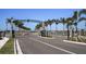 Community entrance to neighborhood with landscaped median and palm trees at 659 Maldives Trl, Sarasota, FL 34234