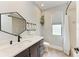 This bathroom features modern fixtures, decorative mirror, and walk-in shower at 6674 Coopers Hawk Ct, Lakewood Ranch, FL 34202