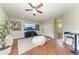 Upstairs bonus room with large television, cork floors, and bench seating at 6674 Coopers Hawk Ct, Lakewood Ranch, FL 34202