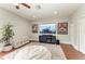 Upstairs bonus room area with large television, bean bag chair, and built in bench seating at 6674 Coopers Hawk Ct, Lakewood Ranch, FL 34202