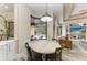 Cozy breakfast nook with view of the pool and open to the living room at 6674 Coopers Hawk Ct, Lakewood Ranch, FL 34202
