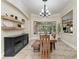 Dining room with natural wood table and view of the screened-in lanai and pool at 6674 Coopers Hawk Ct, Lakewood Ranch, FL 34202