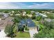 Beautiful home featuring a three-car garage, lush landscaping, and a well-manicured lawn at 6674 Coopers Hawk Ct, Lakewood Ranch, FL 34202