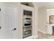 Modern stainless steel appliances, including microwave and double oven, integrated into the kitchen cabinetry at 6674 Coopers Hawk Ct, Lakewood Ranch, FL 34202