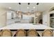 Beautiful kitchen featuring a large center island with seating and stylish pendant lighting at 6674 Coopers Hawk Ct, Lakewood Ranch, FL 34202