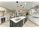 Beautiful kitchen featuring a large island, modern appliances, and an open view to the living and dining areas at 6674 Coopers Hawk Ct, Lakewood Ranch, FL 34202