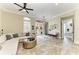 Living room showcasing elegant tile floors, a comfortable seating area, and a bright, inviting atmosphere at 6674 Coopers Hawk Ct, Lakewood Ranch, FL 34202