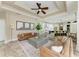 Bright living room featuring an open floor plan, stylish decor, and views of the modern kitchen at 6674 Coopers Hawk Ct, Lakewood Ranch, FL 34202