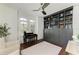 This office boasts wood floors, custom cabinetry, and shuttered windows for a bright workspace at 6674 Coopers Hawk Ct, Lakewood Ranch, FL 34202