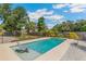 Sparkling backyard pool offers a refreshing escape with surrounding landscaping at 6708 11Th Nw Ave, Bradenton, FL 34209