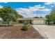 Charming single-story home with an attached garage, lush landscaping, and inviting curb appeal at 6708 11Th Nw Ave, Bradenton, FL 34209