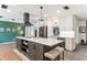 Modern kitchen with stainless steel appliances, a large island, and plenty of storage at 6708 11Th Nw Ave, Bradenton, FL 34209