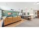 Open-concept living room and kitchen with modern decor, ample seating, and stylish finishes at 6708 11Th Nw Ave, Bradenton, FL 34209