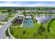 Aerial view of neighborhood amenities including a playground, sport courts, pool and water feature at 6708 162Nd E Pl, Parrish, FL 34219