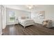 Bright bedroom with natural light, a comfortable bed, and stylish decor at 6708 162Nd E Pl, Parrish, FL 34219