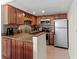 A well-appointed kitchen features granite countertops, stainless steel appliances, and ample cabinet space at 6713 Midnight Pass Rd # 4, Sarasota, FL 34242