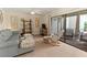 A bright living room with sliding glass doors to the porch, perfect for relaxing and entertaining at 6713 Midnight Pass Rd # 4, Sarasota, FL 34242