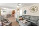 Cozy living room with bright walls and an open layout to the kitchen and direct access to porch at 6713 Midnight Pass Rd # 4, Sarasota, FL 34242
