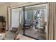 Relax on this inviting porch with comfortable seating and tranquil garden views at 6713 Midnight Pass Rd # 4, Sarasota, FL 34242