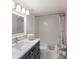 Bright bathroom featuring modern vanity, framed mirror and tub with shower, offering a clean, functional space at 7000 Gulf Dr # 205, Holmes Beach, FL 34217