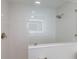 Modern bathroom featuring frameless glass shower and neutral color palette at 7000 Gulf Dr # 205, Holmes Beach, FL 34217