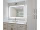 Modern bathroom with a frameless mirror, quartz countertop, and updated vanity at 7000 Gulf Dr # 205, Holmes Beach, FL 34217