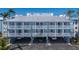 Attractive condo exterior with multiple balconies, offering residents private outdoor spaces with parking below at 7000 Gulf Dr # 205, Holmes Beach, FL 34217