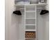 Organized closet with shelves, hanging rods, and storage baskets at 7000 Gulf Dr # 205, Holmes Beach, FL 34217