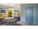 Exterior view of a unit entrance with lush tropical landscaping at 7000 Gulf Dr # 205, Holmes Beach, FL 34217