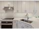 Updated kitchen with stone countertops, stainless steel appliances, and modern fixtures at 7000 Gulf Dr # 205, Holmes Beach, FL 34217