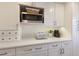 Kitchen with updated cabinetry, stainless steel microwave, and coffee station at 7000 Gulf Dr # 205, Holmes Beach, FL 34217