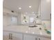 Modern kitchen with white cabinets, stainless steel appliances, and sleek countertops at 7000 Gulf Dr # 205, Holmes Beach, FL 34217