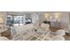 Inviting living room featuring wicker seating, a view to the dining area, and a patio at 7000 Gulf Dr # 205, Holmes Beach, FL 34217