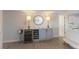 Living space features a wine fridge and a decorative cabinet, adding a touch of elegance and functionality at 7000 Gulf Dr # 205, Holmes Beach, FL 34217