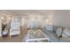 Spacious living room with white furnishings and an open layout, connecting to the dining area at 7000 Gulf Dr # 205, Holmes Beach, FL 34217